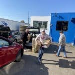 Nolan and his team delivering donations to Matthew 25: Ministries.