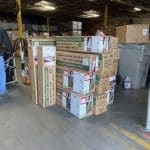 Nolan and his team stocking donations in the warehouse at Matthew 25: Ministries.