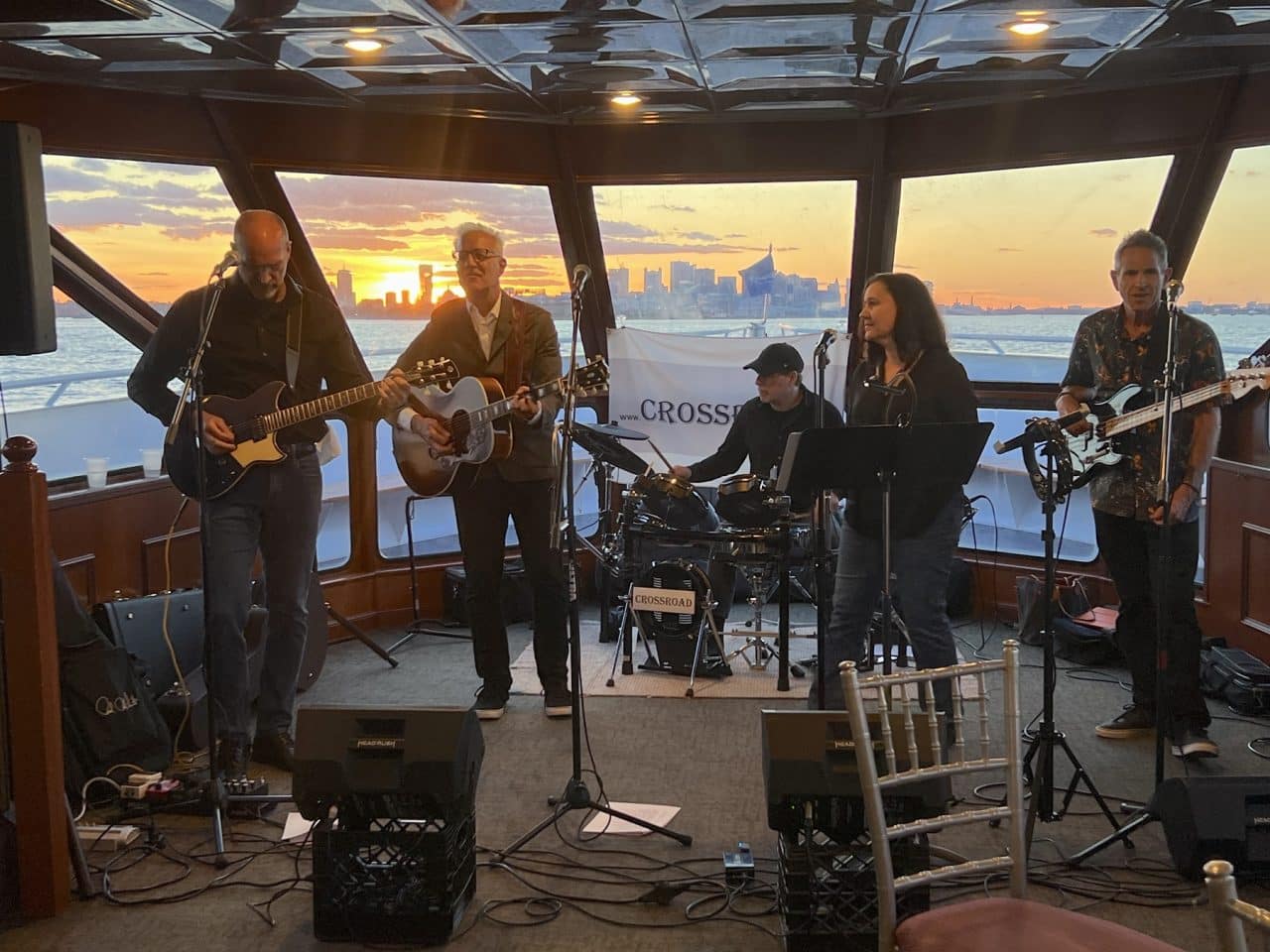 The Crossroad band playing live during sunset at the Bio-IT Harbor Cruise Networking Event.